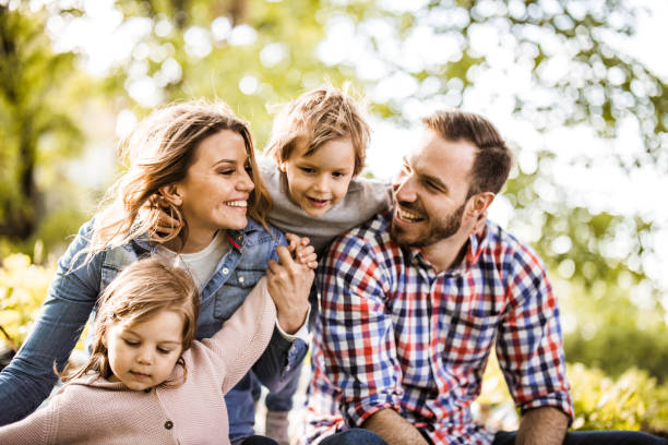 istock Young happy family having fun while spending spring day in nature. 1410023669