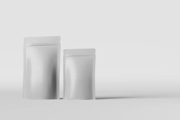 istock White pouch bags mockup branding light background 3D rendering. Merchandise packaging design Blank coffee beans doy pack 1410025487