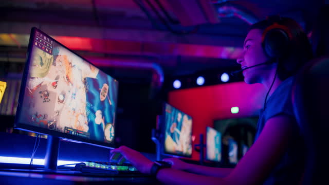 Pro female gamer competing in video game eSport championship