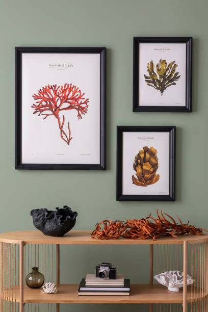 istock Interior design of boho composition at living room interior with wooden console and elegant personal accessories. Mock up poster. Dried flowers in cozy apartment. Home decor. Template. 1410039057