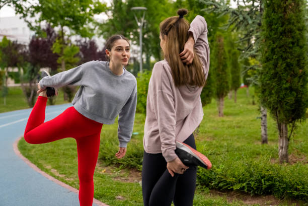 istock Two young women meet outdoor for exercises 1410039969