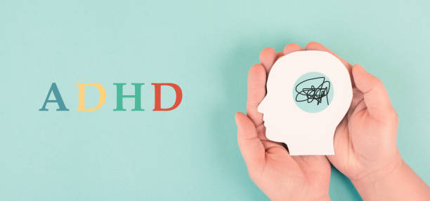 istock Hands holding a silhouette of a human head, attention deficit hyperactivity disorder, ADHD symptom, mental health 1410040640