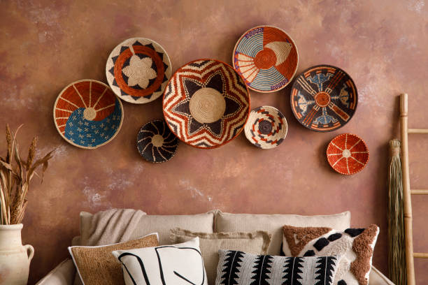 istock The stylish boho composition at living room interior with design beige sofa wicker baskets and patterned pillows. Elegant personal accessories.. Cozy apartment. Home decor. Template. 1410041208