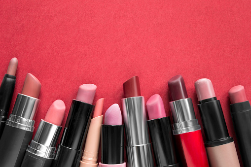 Nude color lipstick collection on red background