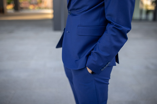Unrecognizable businessman with hands in pocket