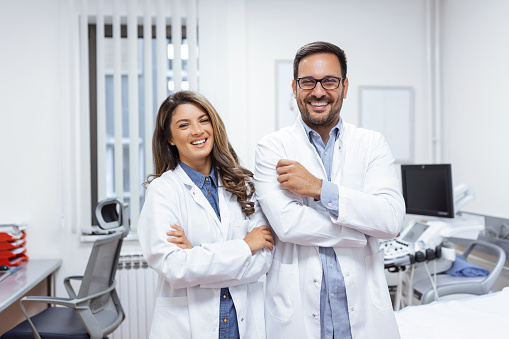 Portrait of two confident young doctors working in a hospital