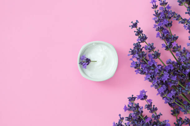 istock Cosmetic cream with lavender flowers top view 1410045624
