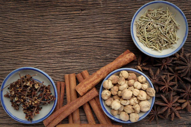 Herbs and spices for cooking in bowls on a wooden background. Top view. empty space for text creative, backdrop, Wallpaper and Design