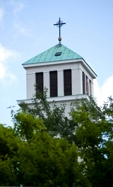 istock Old catholic church tower with cross. 1410052890