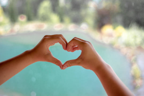 istock The child's fingers show a heart. 1410053124