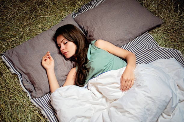 istock Young woman sleeping in a straw 1410054299