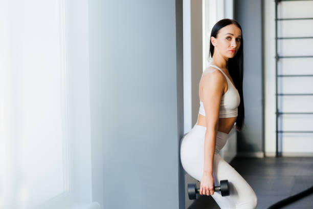 istock Beautiful young girl with perfect muscles. 1410054965