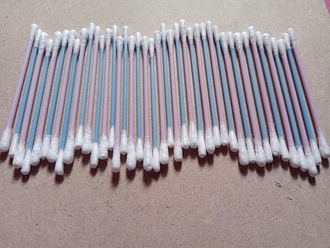 Cotton buds in pink and blue stick color for ear cleaner