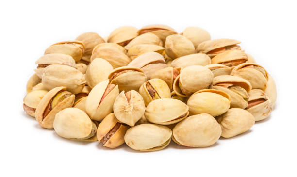 istock Handful of pistachio nuts (Pistacia vera) in the shell, close up 1410059544