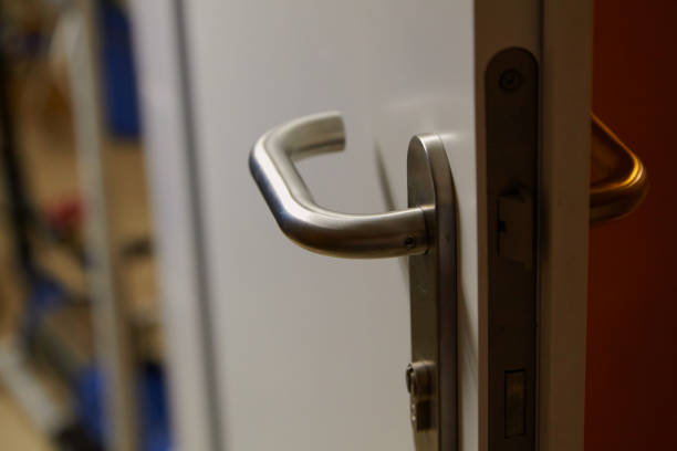 istock Metal handle on plastic door close up 1410060104