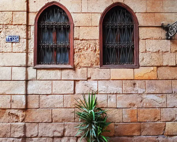 Old stone and wood window view in Cairo, Egypt from the Islamic Mamluk Sultanate times.