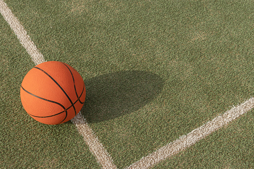 basketball ball isolated on the playing field on the right side there is a place for the inscription. High quality photo