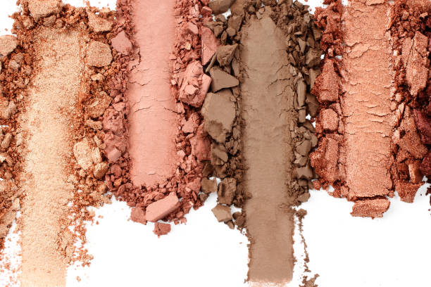 istock Broken and smashed make-up eyeshadow pallete, lay of brush strokes, on white background, top view. Sample cosmetics concept 1410064146