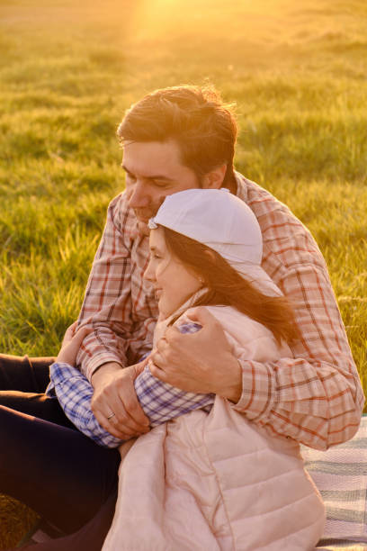 istock Smiling little girl hugging her father outside 1410065267