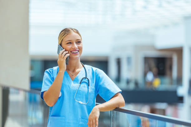 istock Female therapist wearing stethoscope using smart phone 1410065275