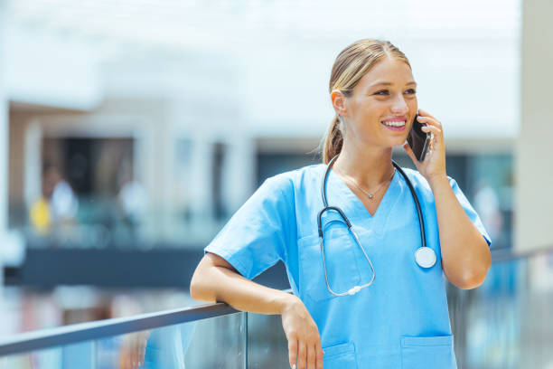 istock Happy young general practitioner chatting online on mobile phone 1410065279