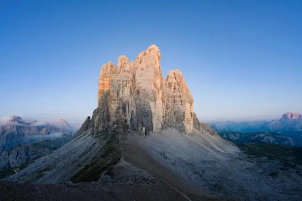 Photo of Stunning view of the Three Peaks of Lavaredo, (Tre cime di Lavaredo) during a beautiful sunrise. The Three Peaks of Lavaredo are the undisputed symbol of the Dolomites, Italy.