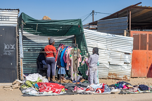 Vendors busy preparing clothes to sell at a Street Market at Katutura Township near Windhoek in Khomas Region, Namibia