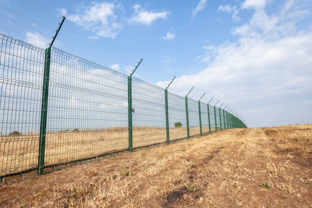 istock New Security Fencing Boundary Outdoors. 1410068858