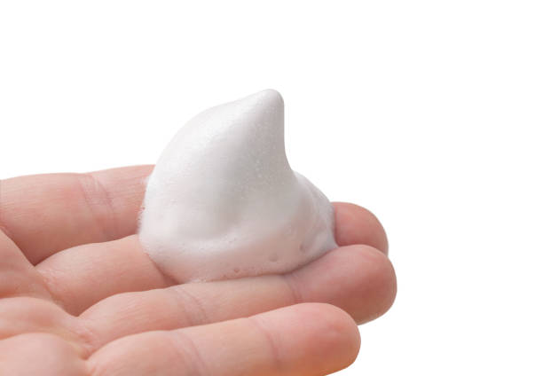 istock Hand holding shaving foam isolated on white. 1410069356