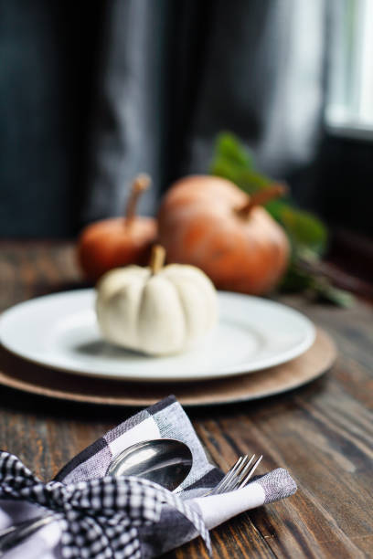 Silverware for Thanksgiving Day Table with Place Setting and White Pumpkin stock photo