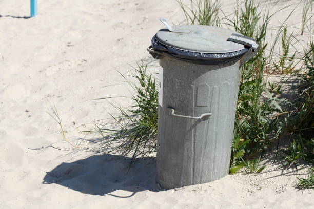 istock Public metal garbage can on a beach, Germany 1410070883