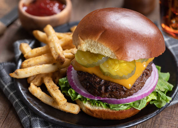 istock Cheeseburger with pickles, onions and lettuce 1410073624