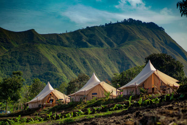 istock Three Glamping tent with hill on background 1410073797
