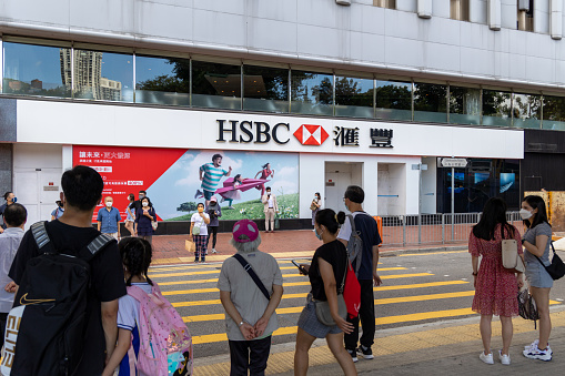 Hong Kong - July 21, 2022 : Pedestrians near the HSBC branch in Causeway Bay, Hong Kong.