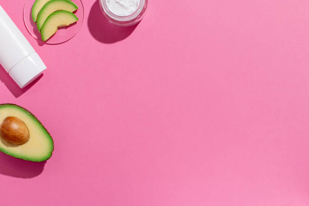 istock Avocado skin care cosmetics flat lay frame on pink 1410075101