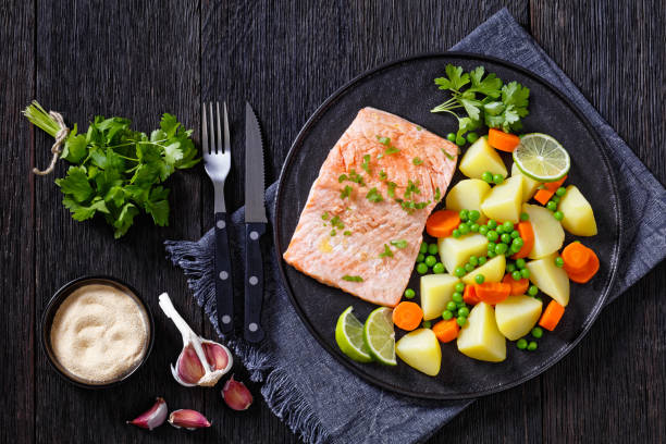 istock Multi Cooker salmon, carrots, peas and potatoes 1410078395