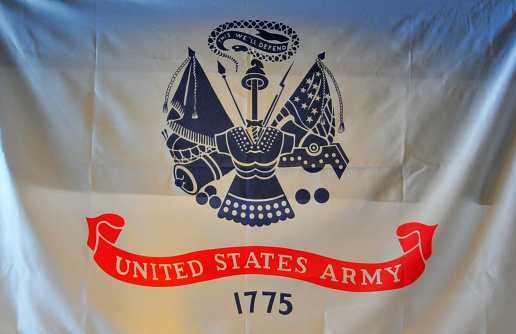 United States Army flag - Displays the Department of the Army Seal (War Office), beneath the seal is a broad scarlet scroll bearing the inscription in white letters, \