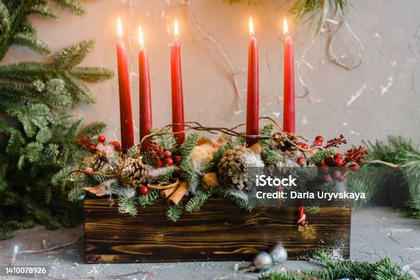 Decorative Christmas Composition With Five Red Candles And Pine Stock Photo - Download Image Now
