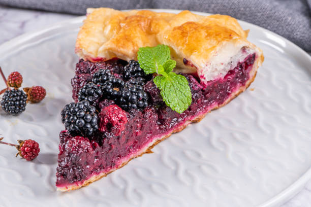 istock Sliced blackberries pie. Pie in summer with fresh picked wild blackberries. 1410078972