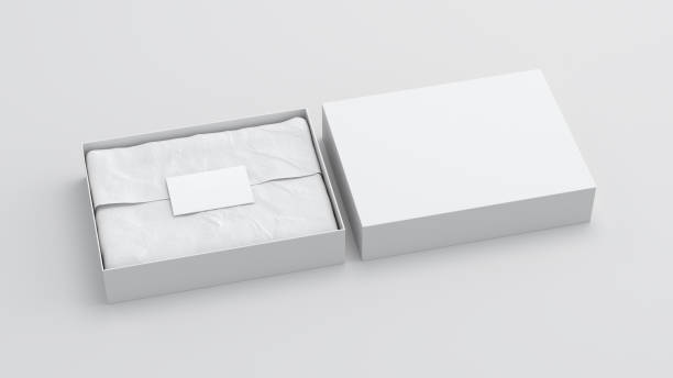 istock Gift box mock up with cover. White gift box with blank label or business card on wrapping paper. White background. Side view. 1410079042