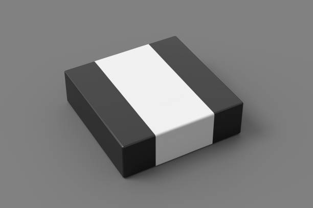 istock Square box mock up with blank paper cover label: Black gift box on gray background. Side view. 1410079232