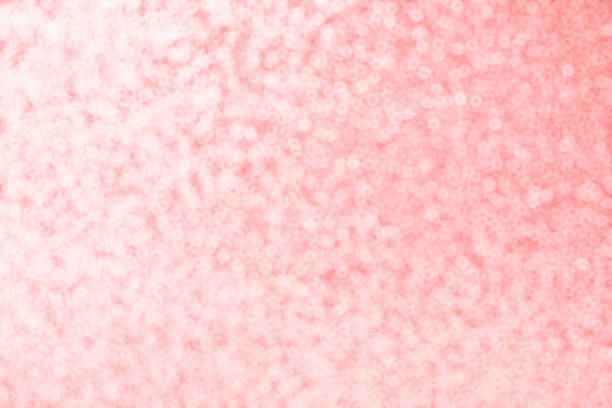Abstract festive pink bokeh background texture with colorful circles. Magic background witn bokeh lights.