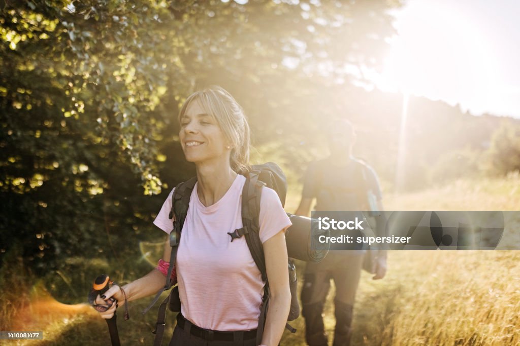 We can continue our journey A young couple steps through the path that leads to the top of the mountain 30-34 Years Stock Photo
