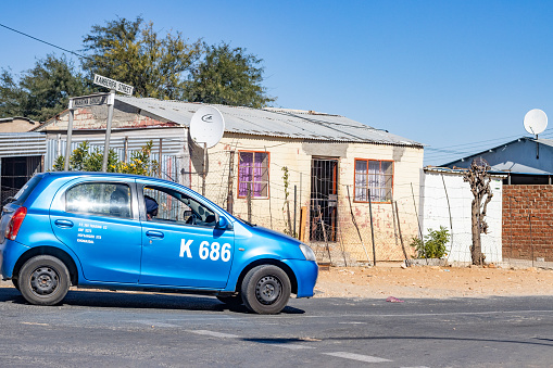 Taxi at Katutura Township near Windhoek at Khomas Region, Namibia, with the driver visible.