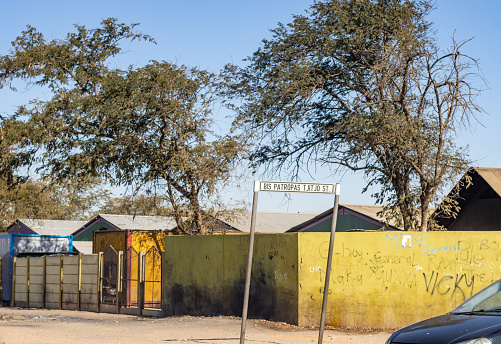 Etosha Pan, Namibia . A signpost at Salvadora Waterhole, telling visitors to stay in their car. It is a wild area, and some poeple treat it like a zoo, it is dangerous to exit your vehicle.