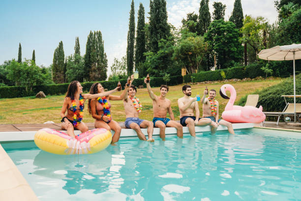 istock Friends are toasting together during a pool party 1410086223
