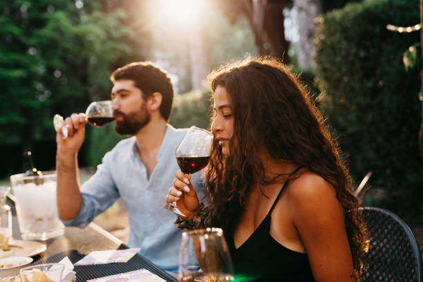 people are having a wine tasting experience at the farmhouse - winetasting imagens e fotografias de stock