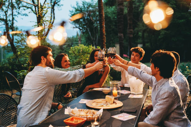 istock Friends toasting together at dinner 1410086294