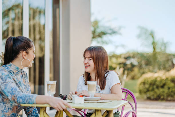 istock Lesbian couple chatting in the afternoon over coffee 1410086547