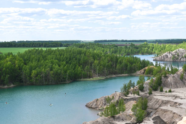 istock Landscape with rocks, river and forest. Clear summer warm day in nature 1410088372